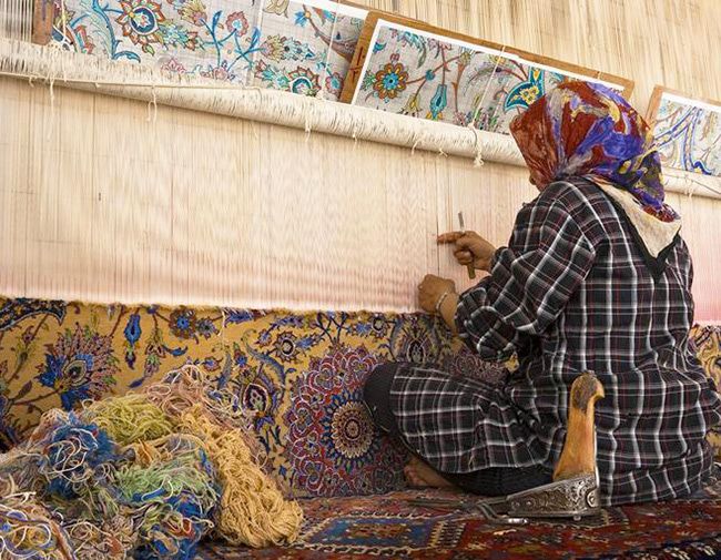 iranian-woman-weaving-persian-rugs-nazmiyal-antique-rugs.jpg.optimal